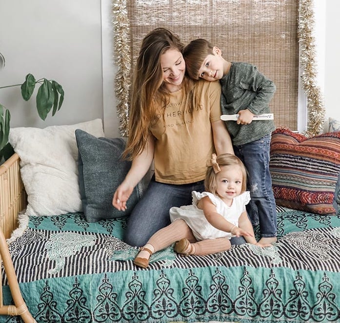 Katherine Tuttle and her two children settling into their new home