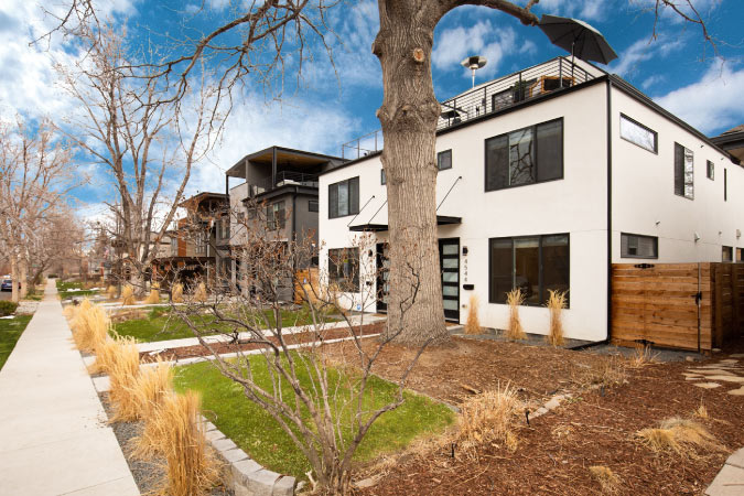 A row of large modern duplexes in the Berkeley neighborhood of Denver, Colorado.