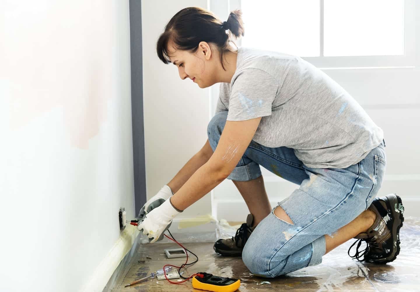 woman doing electrical work in the home