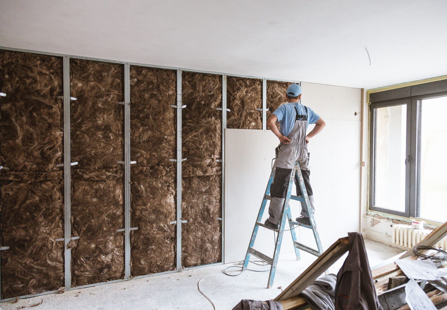 a man installing drywall