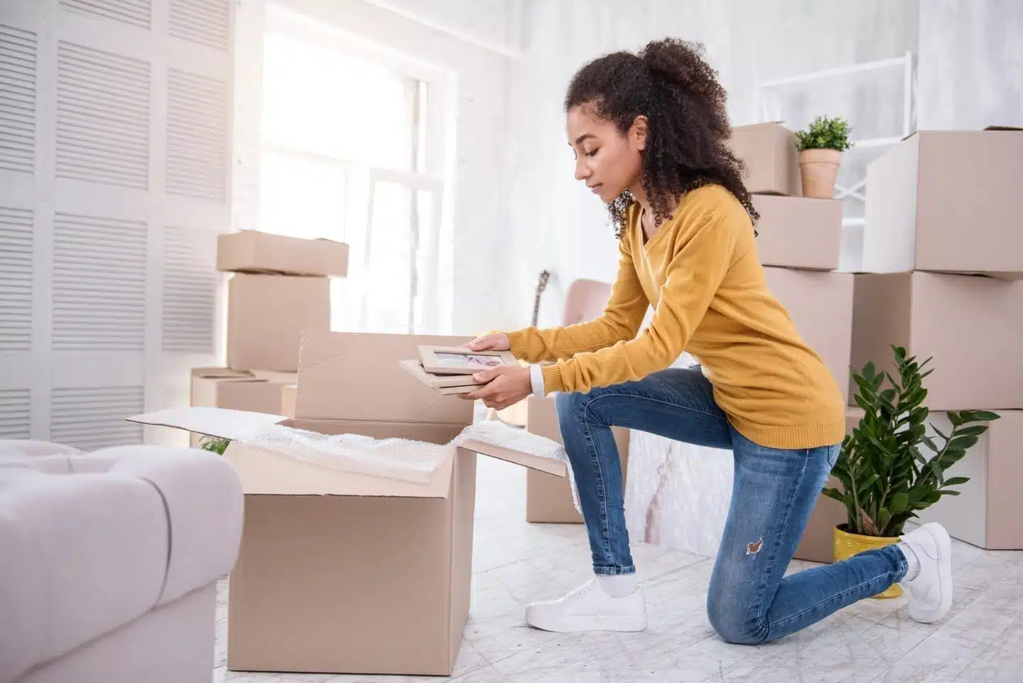 Woman packing photos