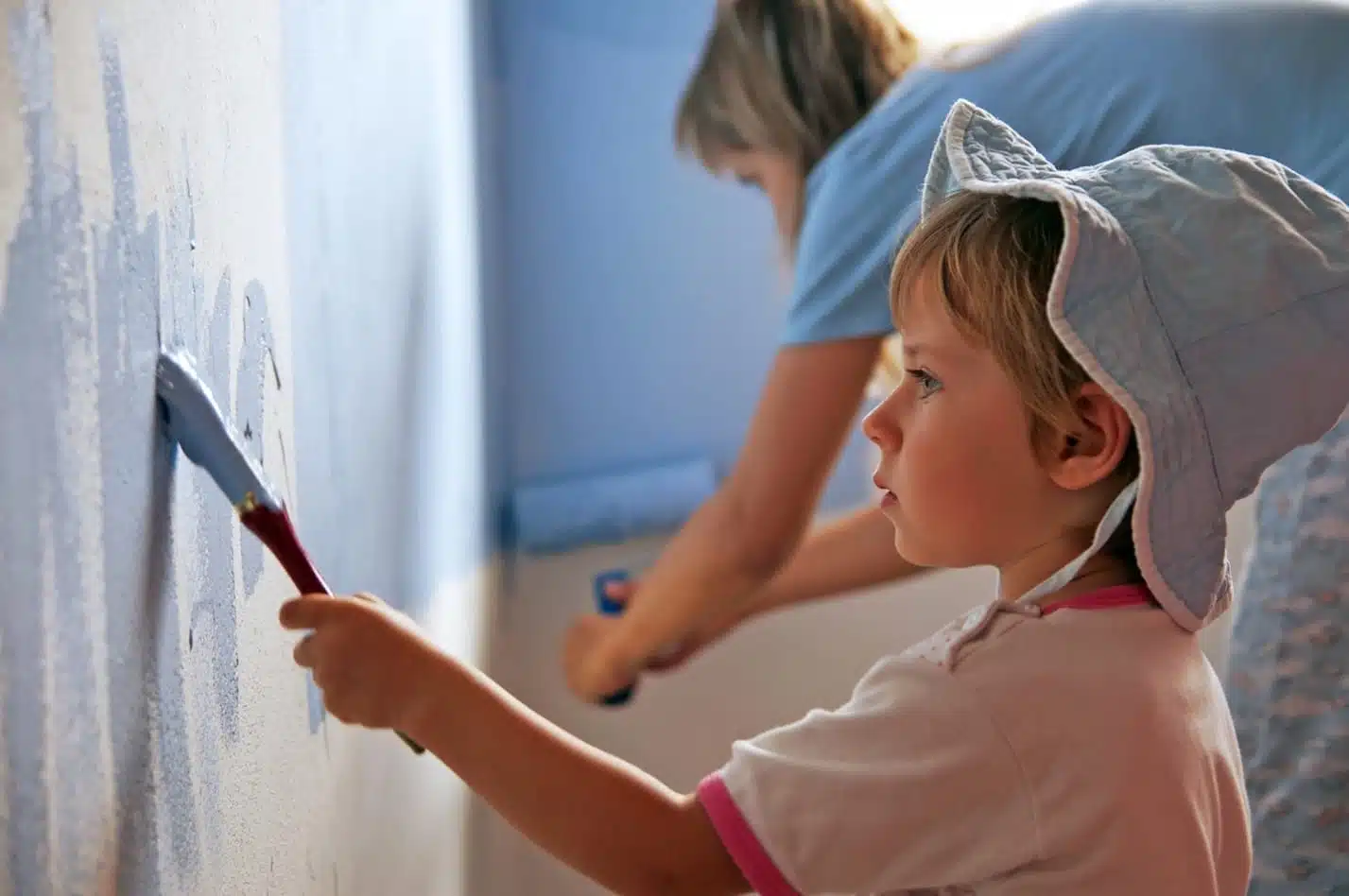 boy painting on wall