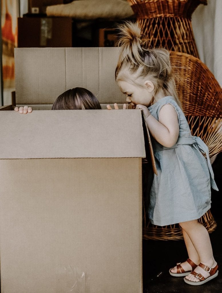 kids playing in a moving box