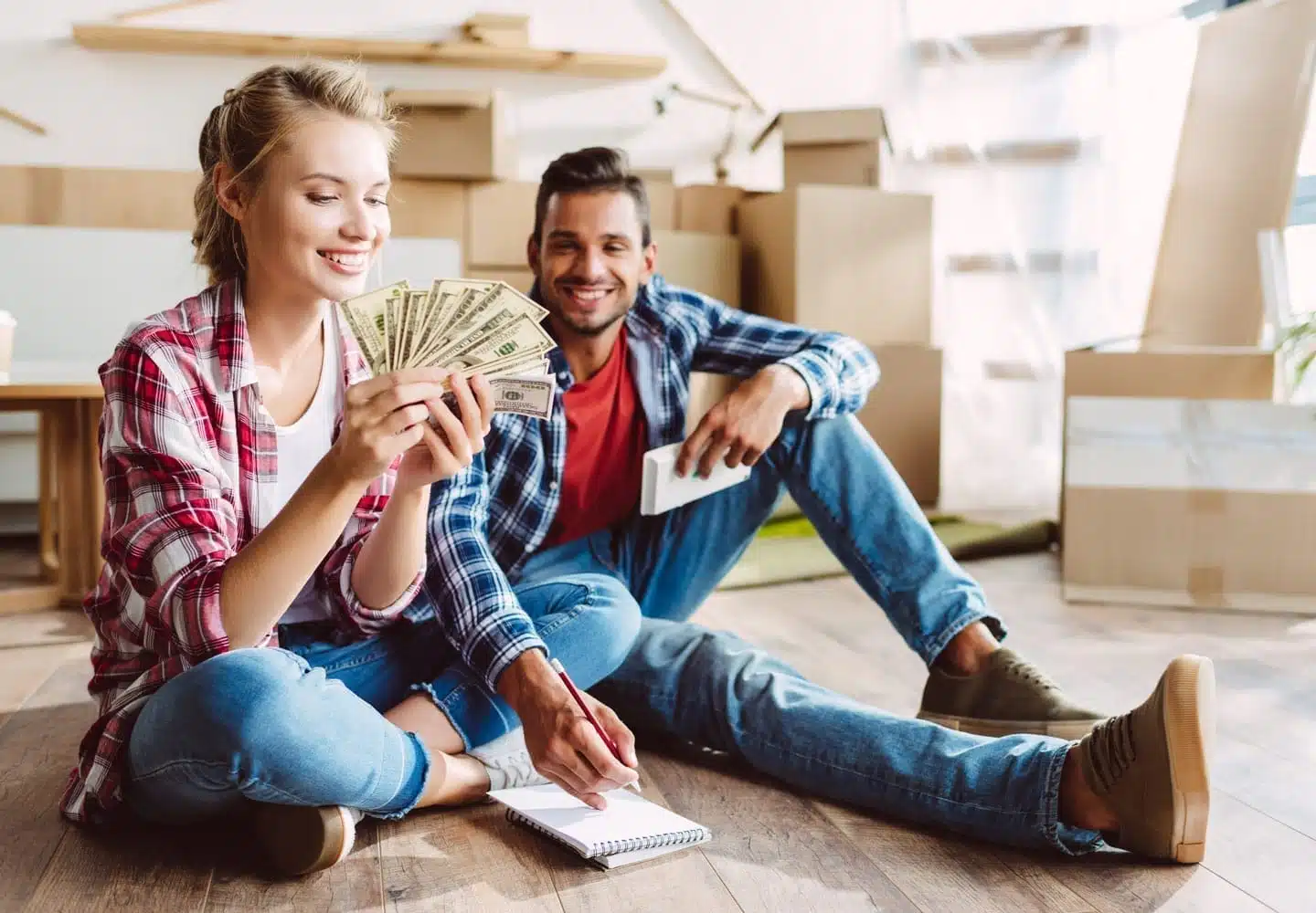 Couple counting money during move