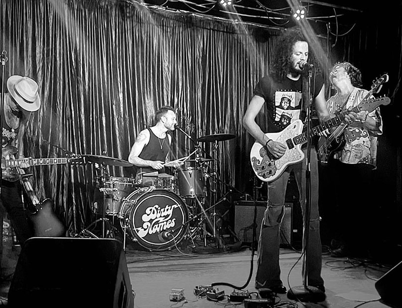 A black-and-white still of The Dirty Names, a local Nashville band, performing at a local rock n' roll venue. Living in Nashville, TN means tons of bands to check out.