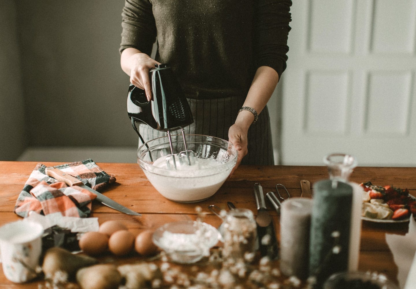 woman mixing batter in a temporary kitchen during home remodeling