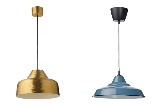  Side-by-side promotional images of large pendant statement lights from IKEA. The lamp on the left has a bronze finish and the one on the right is painted blue.