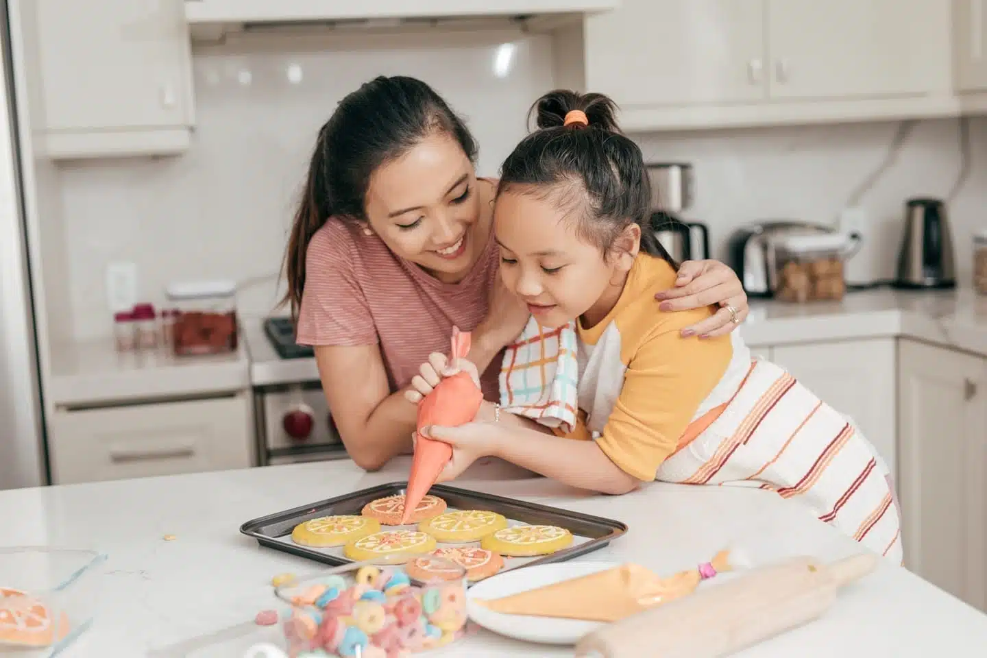 mom and daughter making cookies