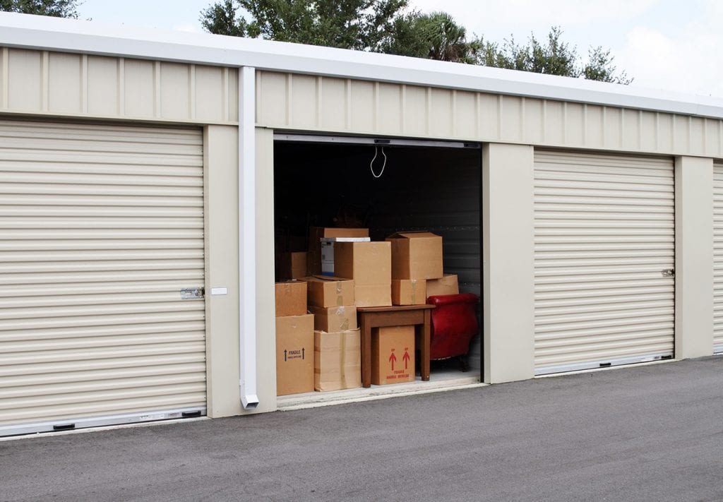 moving boxes and furniture in a self storage unit