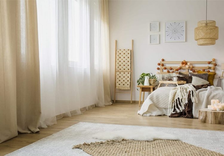 Full-length curtains make a room look larger while also adding softness and style.