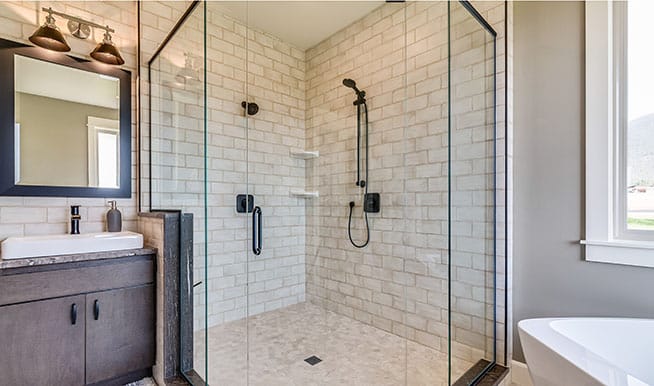 A trapezoidal shower brings interest in an awkward corner of the room, maximizing the available space.