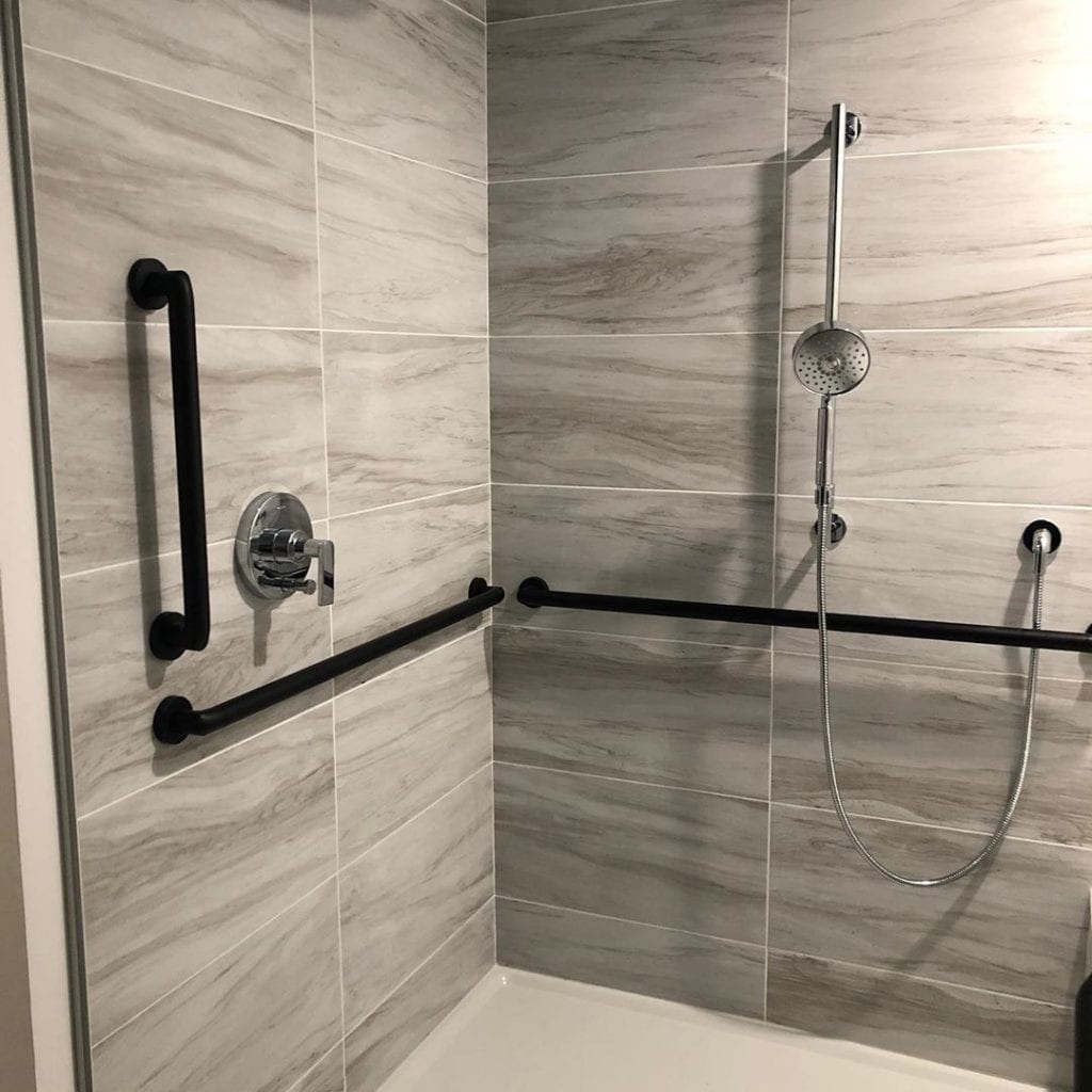 aging in place walk-in shower with handrails for safety