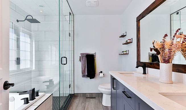 A bathroom which features a large walk-in shower. The shower acts as the centerpiece of the room.