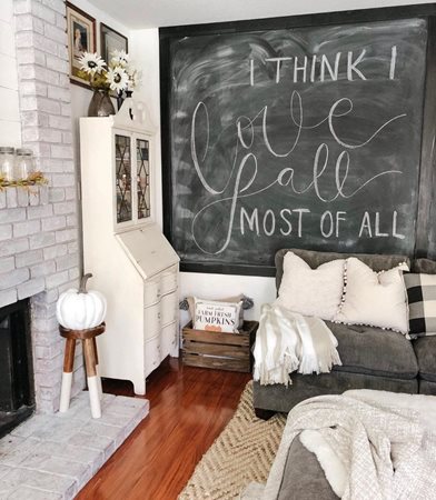 A bedroom with chalkboard wall