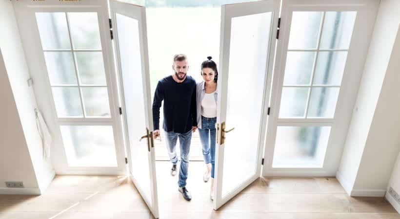 Couple entering home