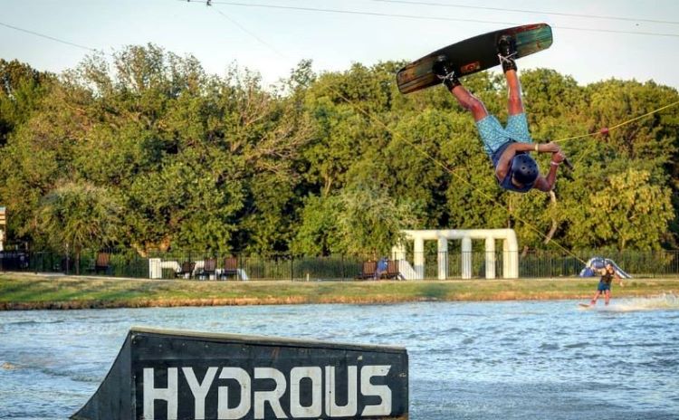 Wakeboarder at Hydrous Wake Park in Allen, Texas — one of many Dallas suburbs.
