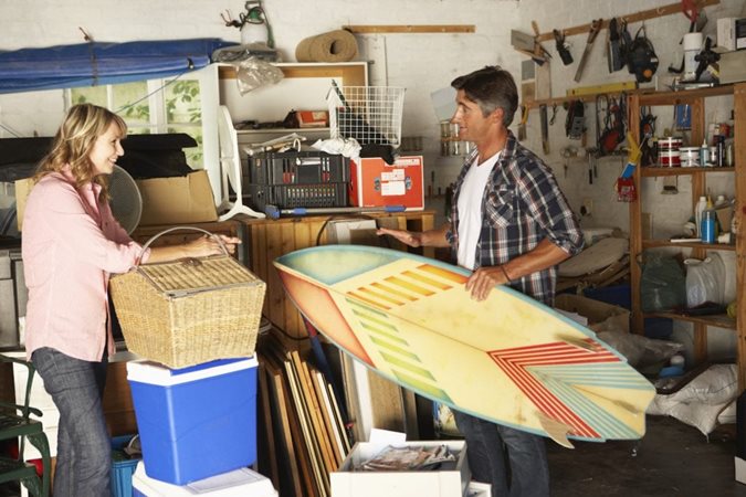 A married couple clearing out their garage