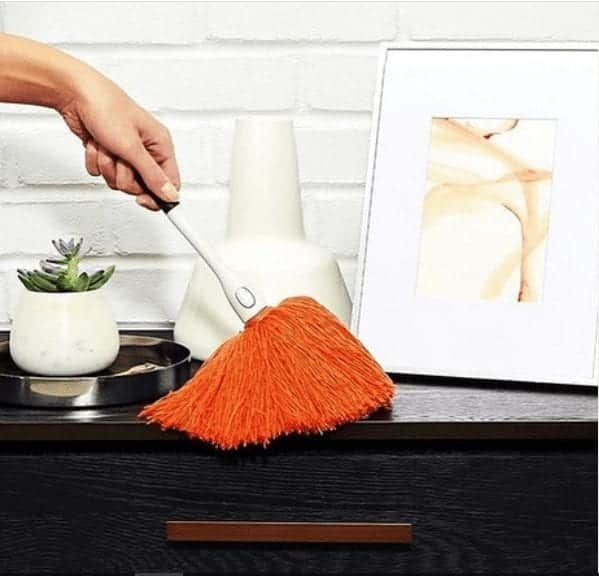 Dusting shelves during spring cleaning