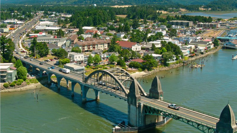 Aerial view  of Florence, a small city on the banks of the Siuslaw River in Lane County, Oregon on a sunny day in summer.