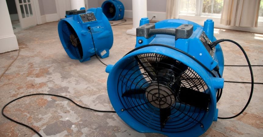 Large fans dry home after water damage