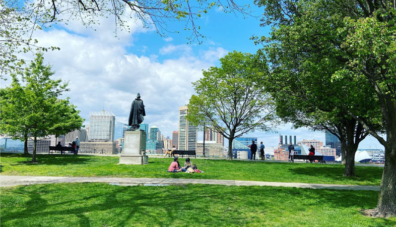 Locals enjoying a sunny day at Federal Hill Park in the Federal Hill neighborhood of Baltimore, Maryland. 