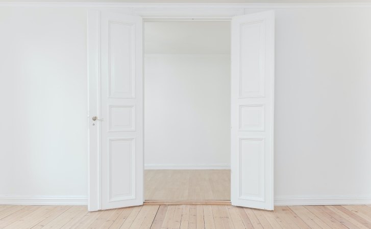 View of a clean, empty apartment, ready for the landlord to do a final walk-through and inspection.