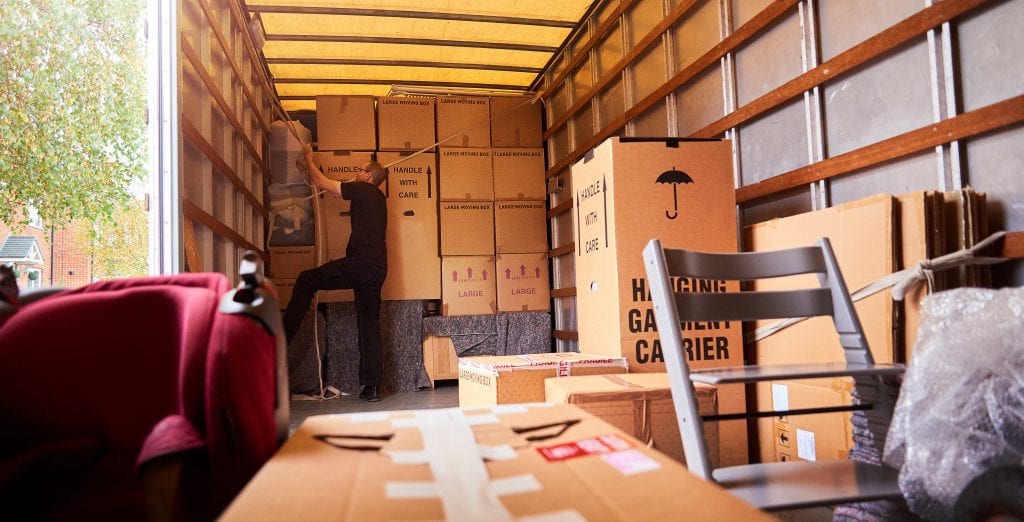 Moving truck filled with furniture and boxes
