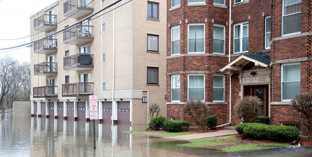 flooded street and apartment buildings