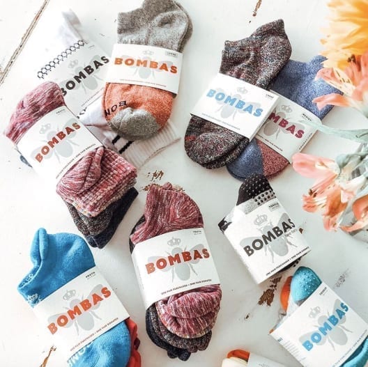 several packs of colorful Bombas socks