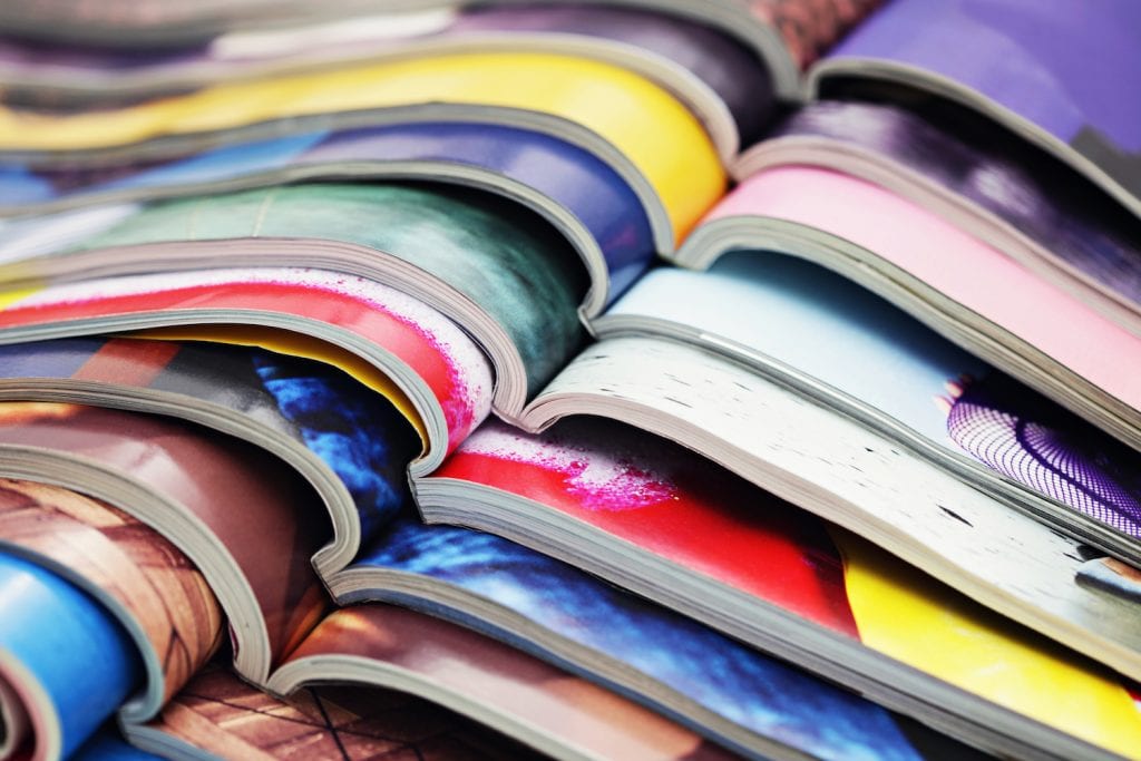 A stack of colorful magazines