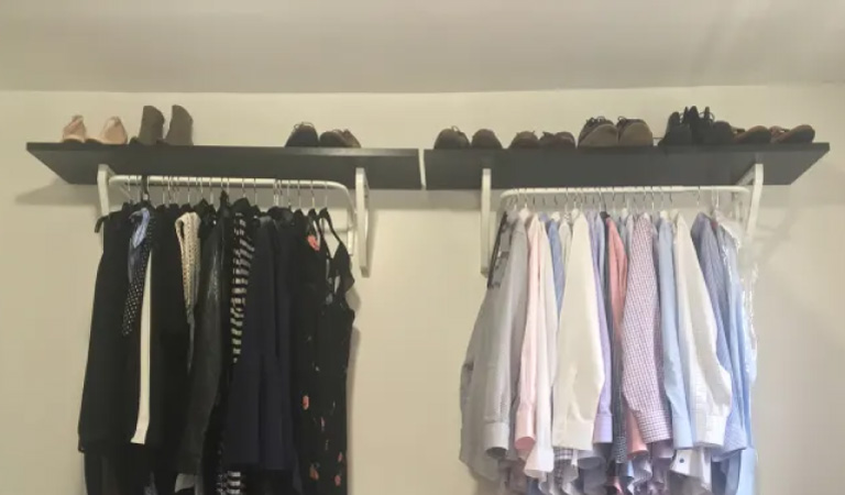 IKEA shelves and metal rails for simple closet storage.