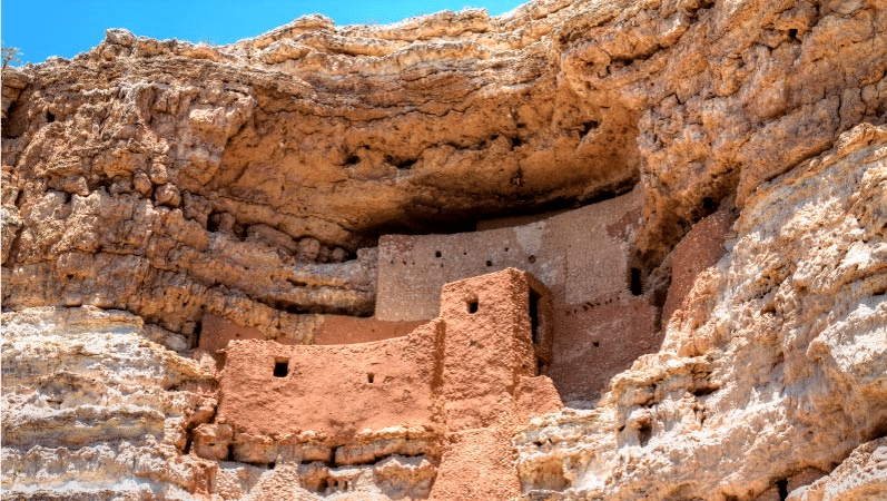 Montezuma Castle National Monument in Camp Verde, AZ. A bright mid-day sun reflects off the structure, built into the side of the cliffs.