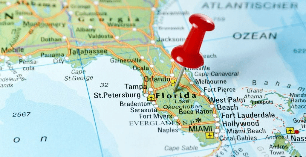 A map of the state of Florida with a red pushpin placed right above the state’s name.