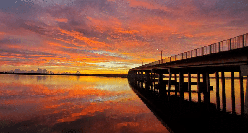 A vibrant sunset over the St. Johns River in Palatka, Florida.