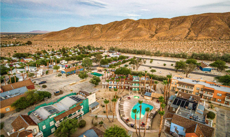 Aerial view of the desert town of Borrego Springs, California, with the mountains in the background.