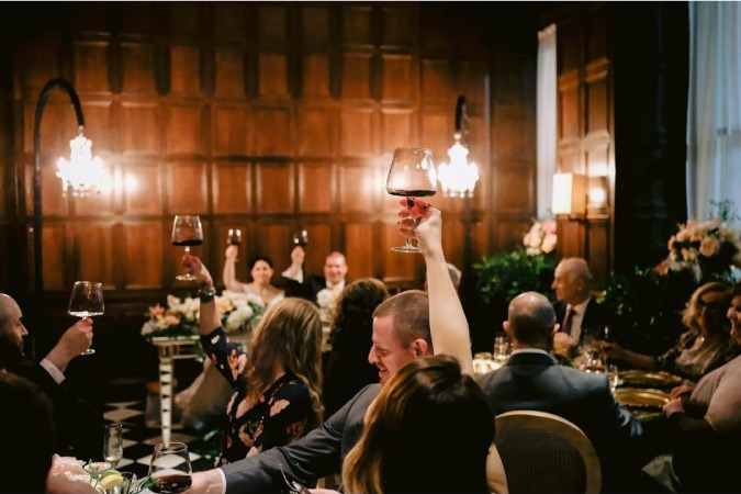 Patrons raise their glasses during a toast at Barclay Prime, a Stephen Starr restaurant in Philadelphia, Pennsylvania.