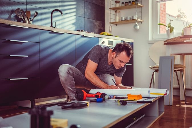 man working on a kitchen remodel