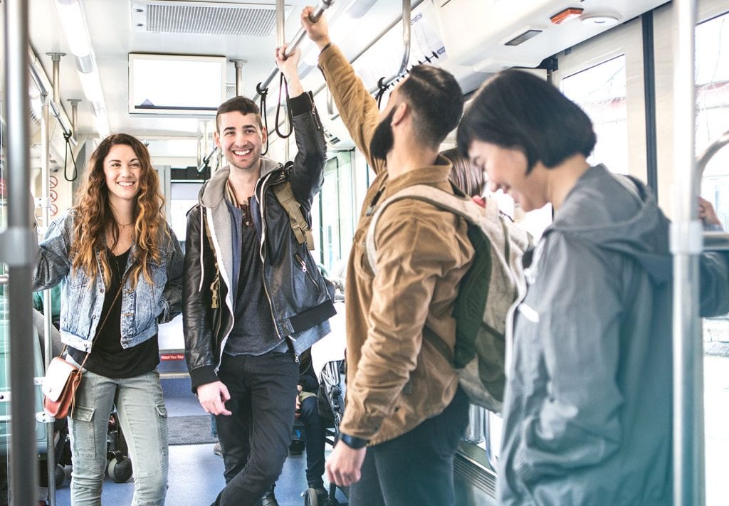 Friends riding public transit