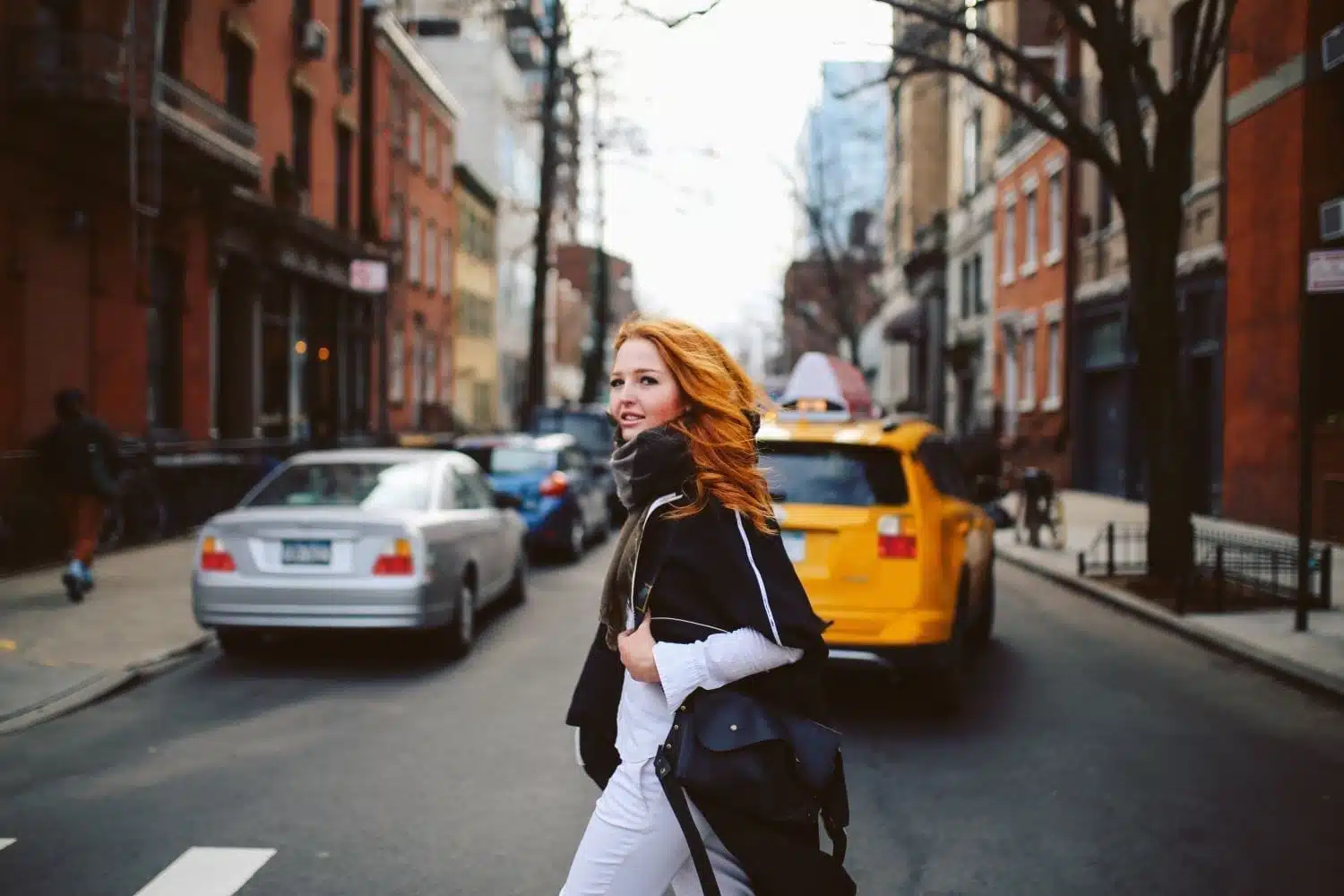 A redheaded woman moving in NYC