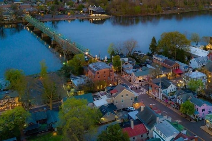 Aerial view of the town of New Hope, Pennsylvania, at dusk. New Hope is an idyllic town with lovely buildings in cheerful colors.