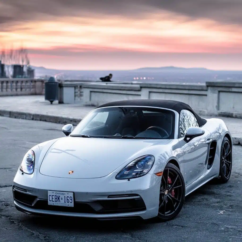 white porsche with sunset