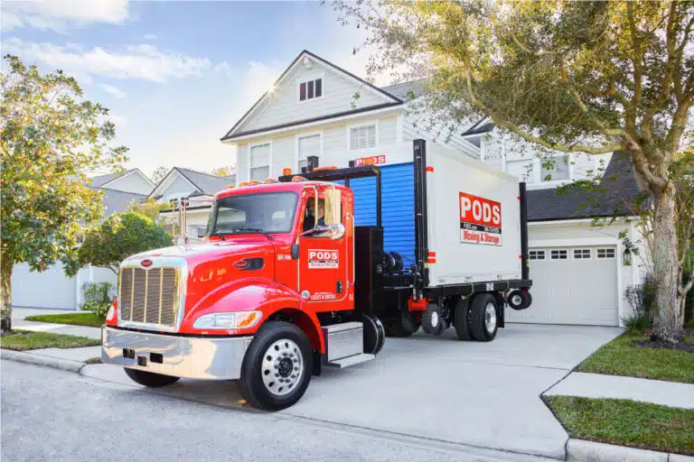 PODS truck with PODS container in driveway