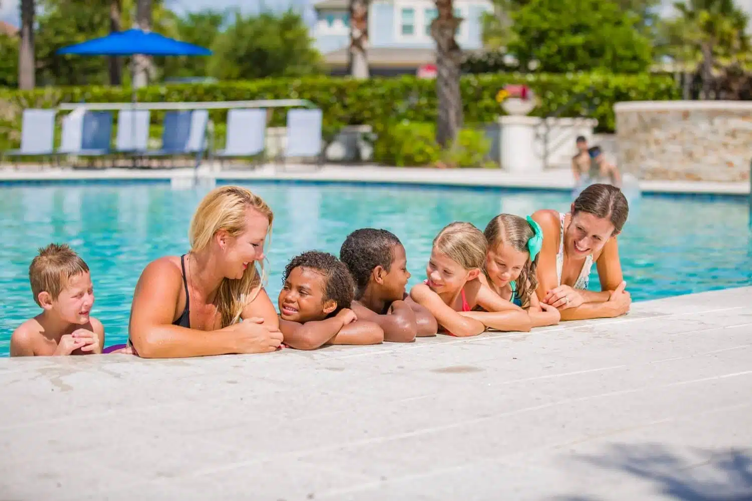 a woman and kids in a community pool near Brandon, FL