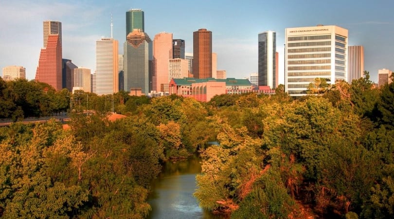 Aerial view of Buffalo Bayou Park in Houston, Texas, with the city skyline in the background.