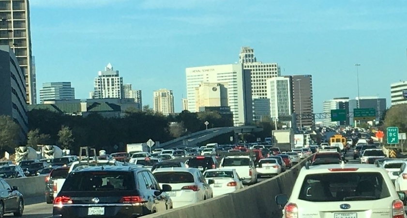 Several lanes are filled with bumper-to-bumper traffic in Houston, Texas.
