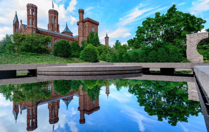 A view of The Smithsonian Institution and its reflection in an onsite water feature.