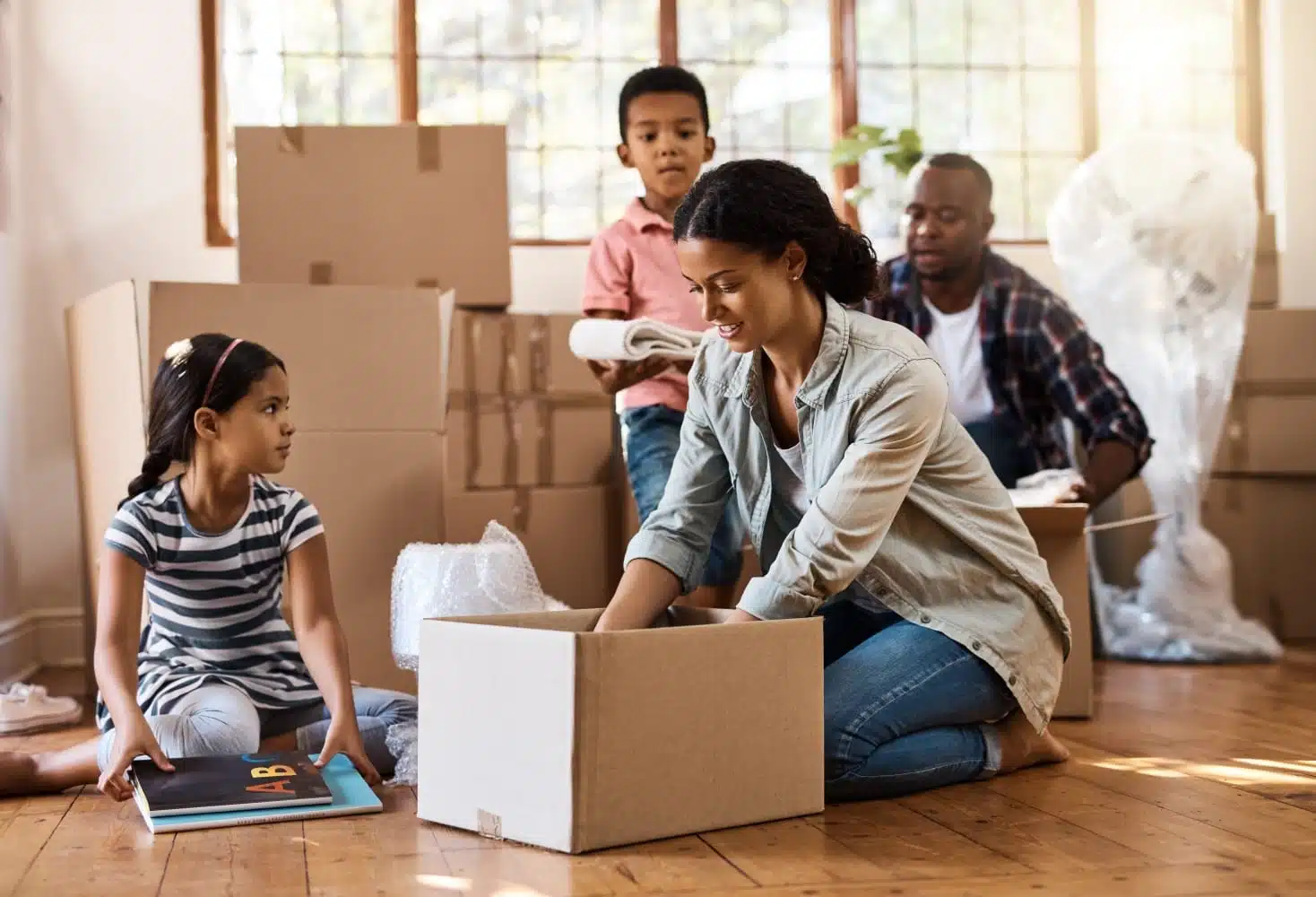 family packing moving boxes