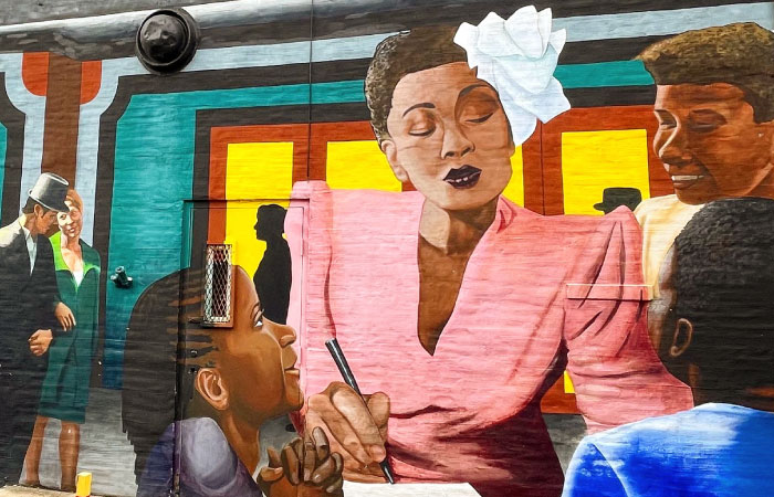 A colorful mural of Billie Holiday, painted by Bridget Cimino, located on S. Durham Street in Baltimore’s Fells Point neighborhood.