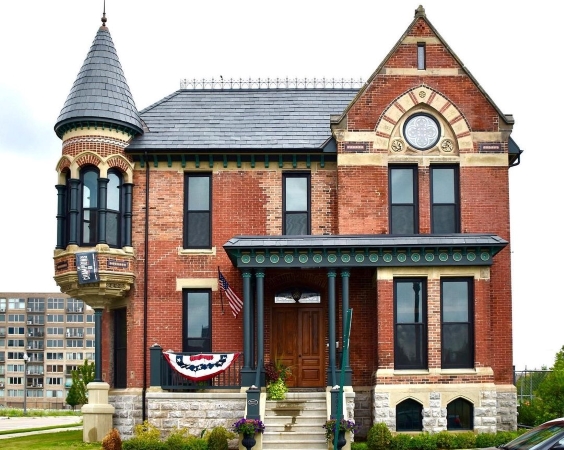 A very large brick mansion in the Midtown Detroit neighborhood of Brush Park. The home features impressively detailed masonry around the windows. 