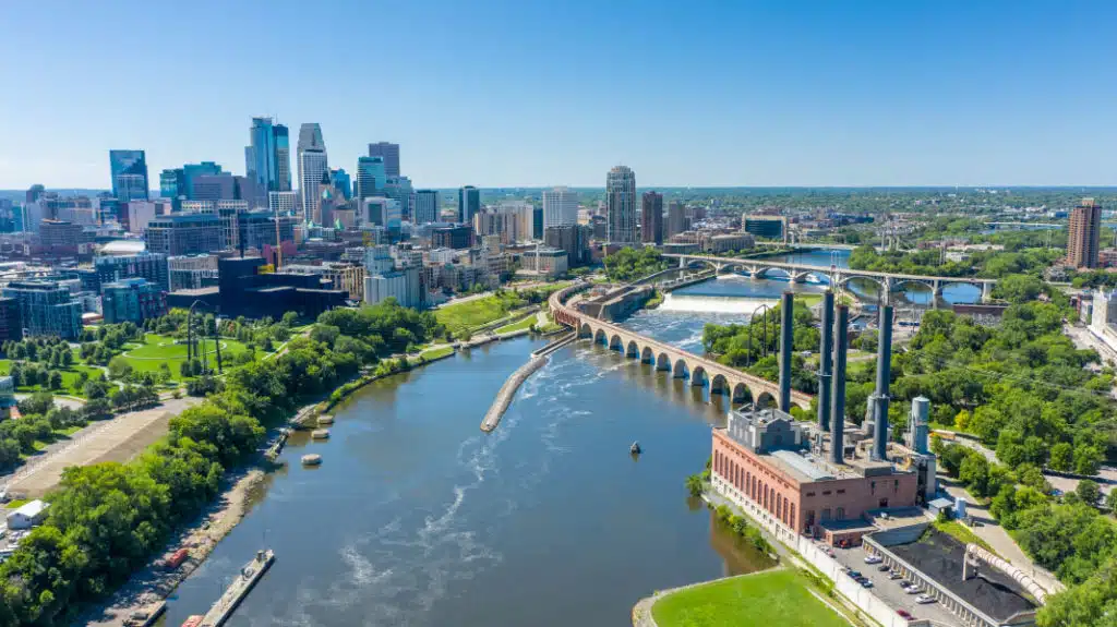 Aerial view of downtown Minneapolis and the Mississippi River on a sunny summer day.